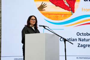 Conference Speaker with Colorful Event Backdrop